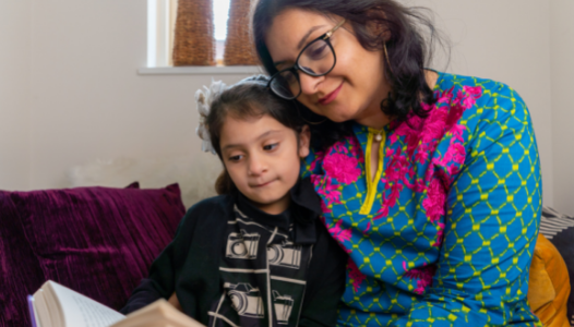 Adult and child reading