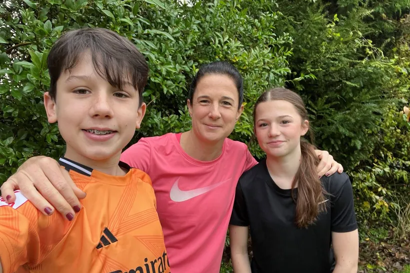 Vicky and her two children taking a selfie outdoors