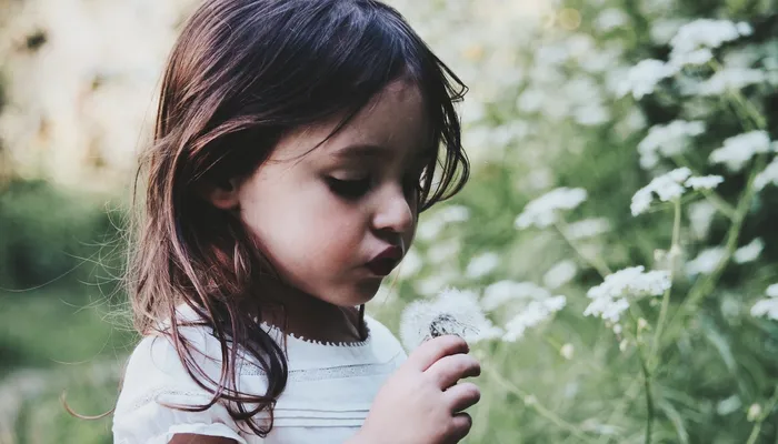 Worried girl with flower