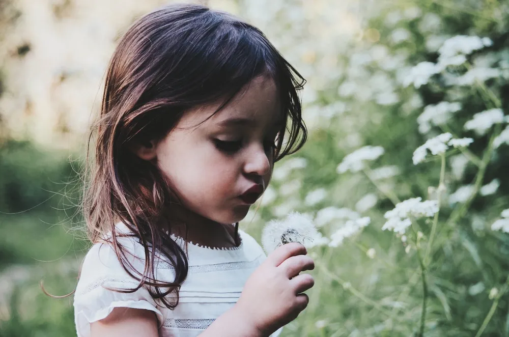 Worried girl with flower