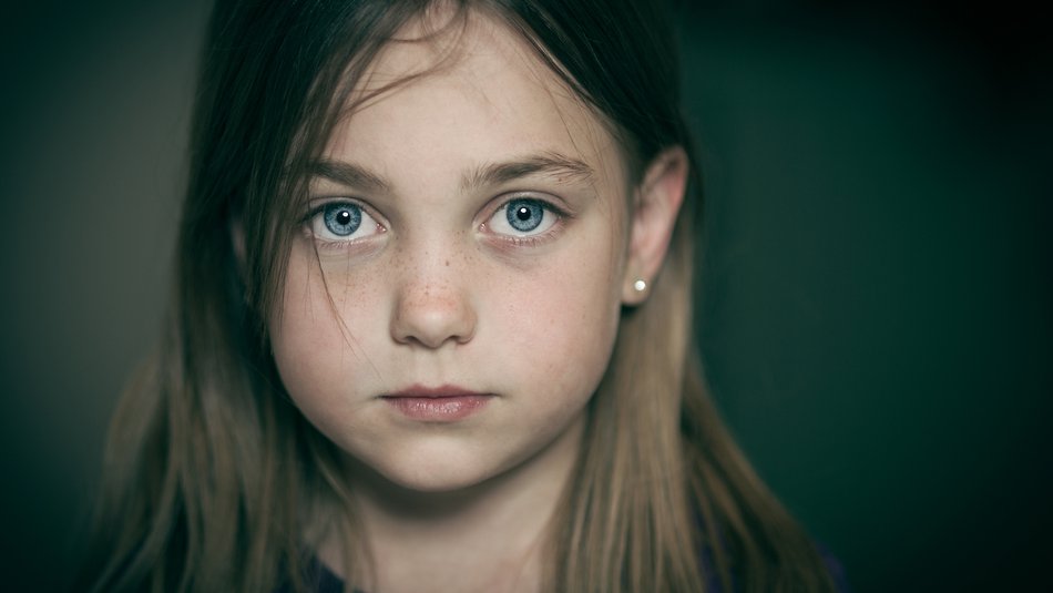 Worried young girl looking at camera.jpg