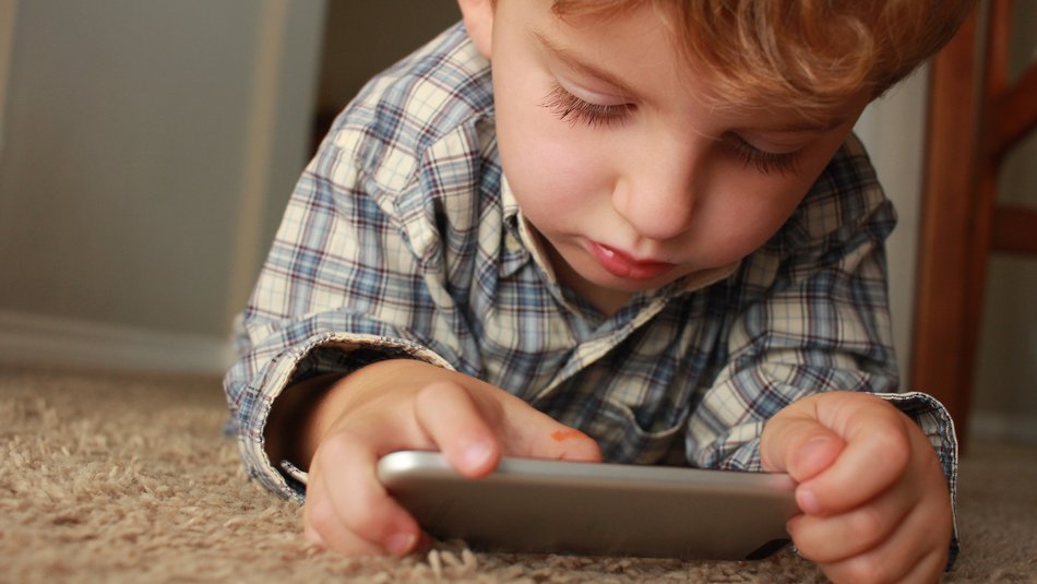 Young boy on phone