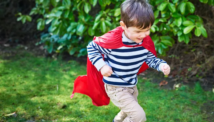 Young boy with red cape