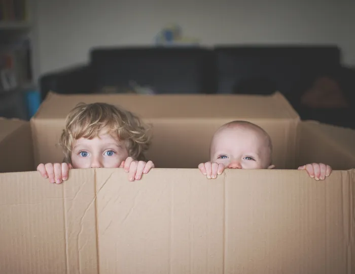 Young boys playing in box