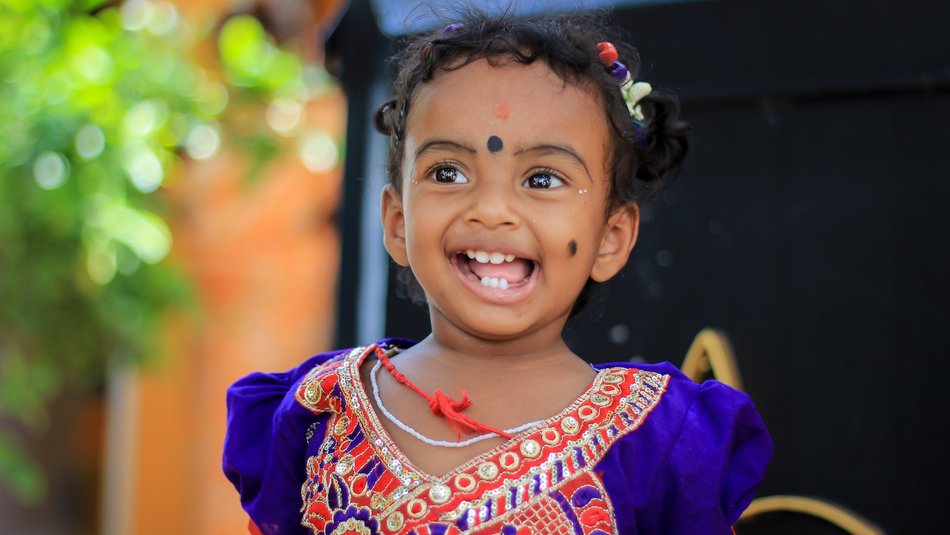 Young girl in colourful dress