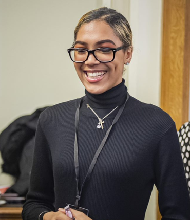 Young woman in a conversation smilling
