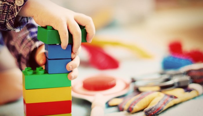 child playing with bricks