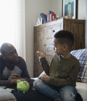 dad teaching son about money