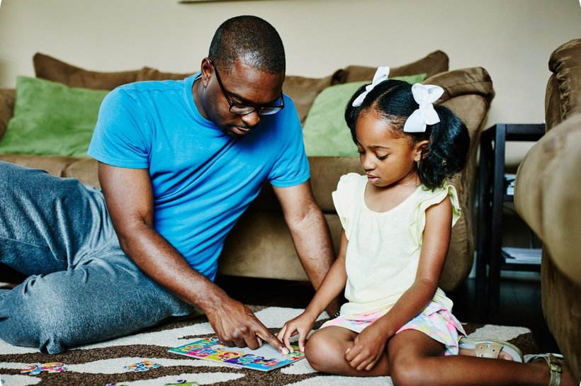 father and daughter playing