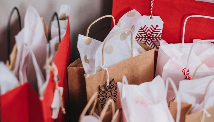 Group of shopping bags full of Christmas presents