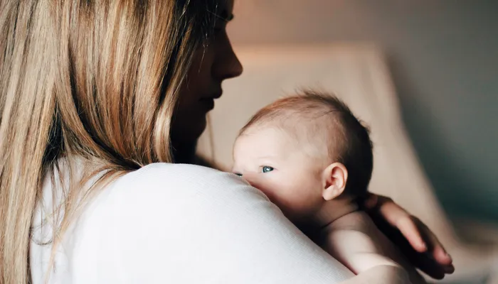 Mother holding newborn baby