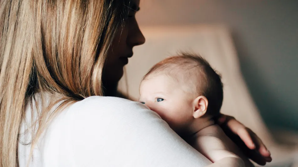 Mother holding newborn baby