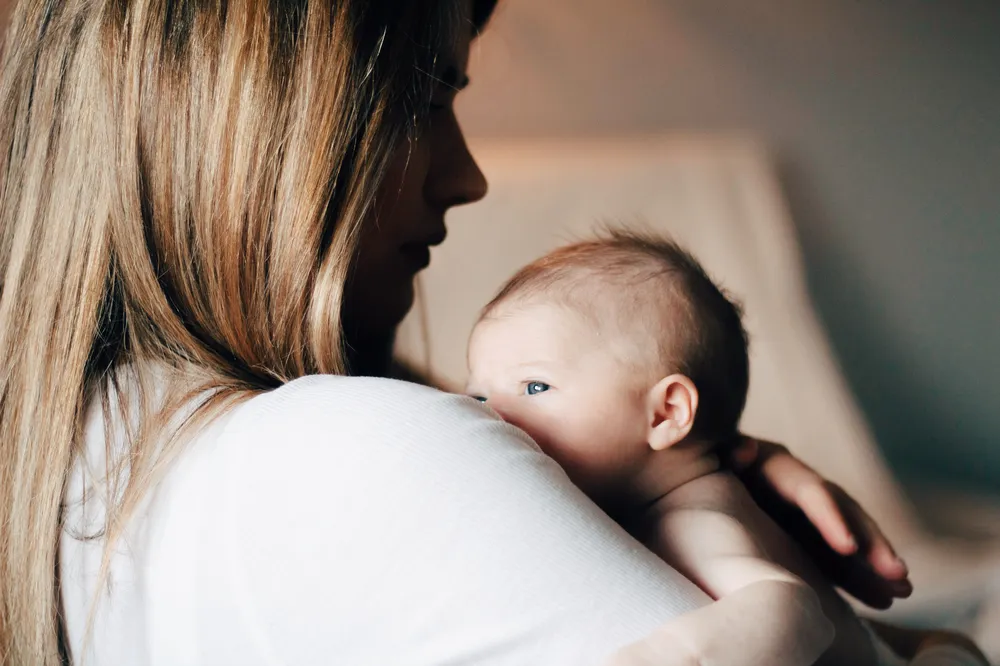 Mother holding newborn baby