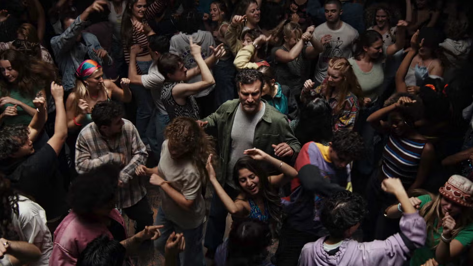 Man standing in a crowd at a rave