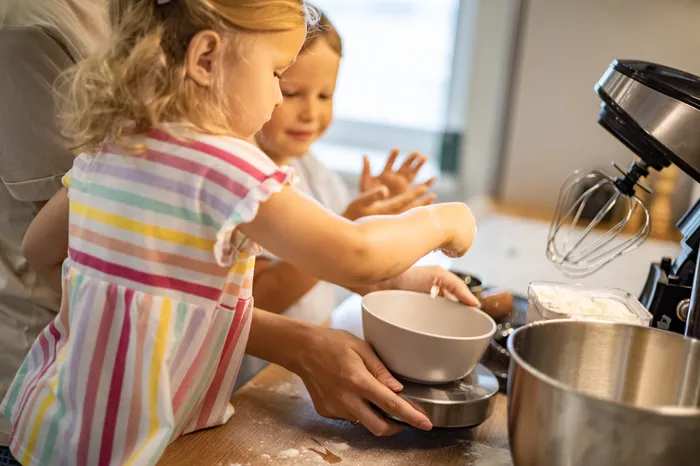 Child baking in kitchen
