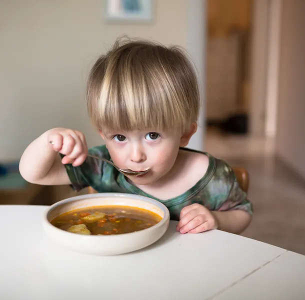 Child eating soup